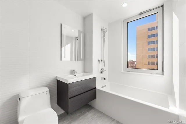 a bathroom with a toilet a sink and a bathtub