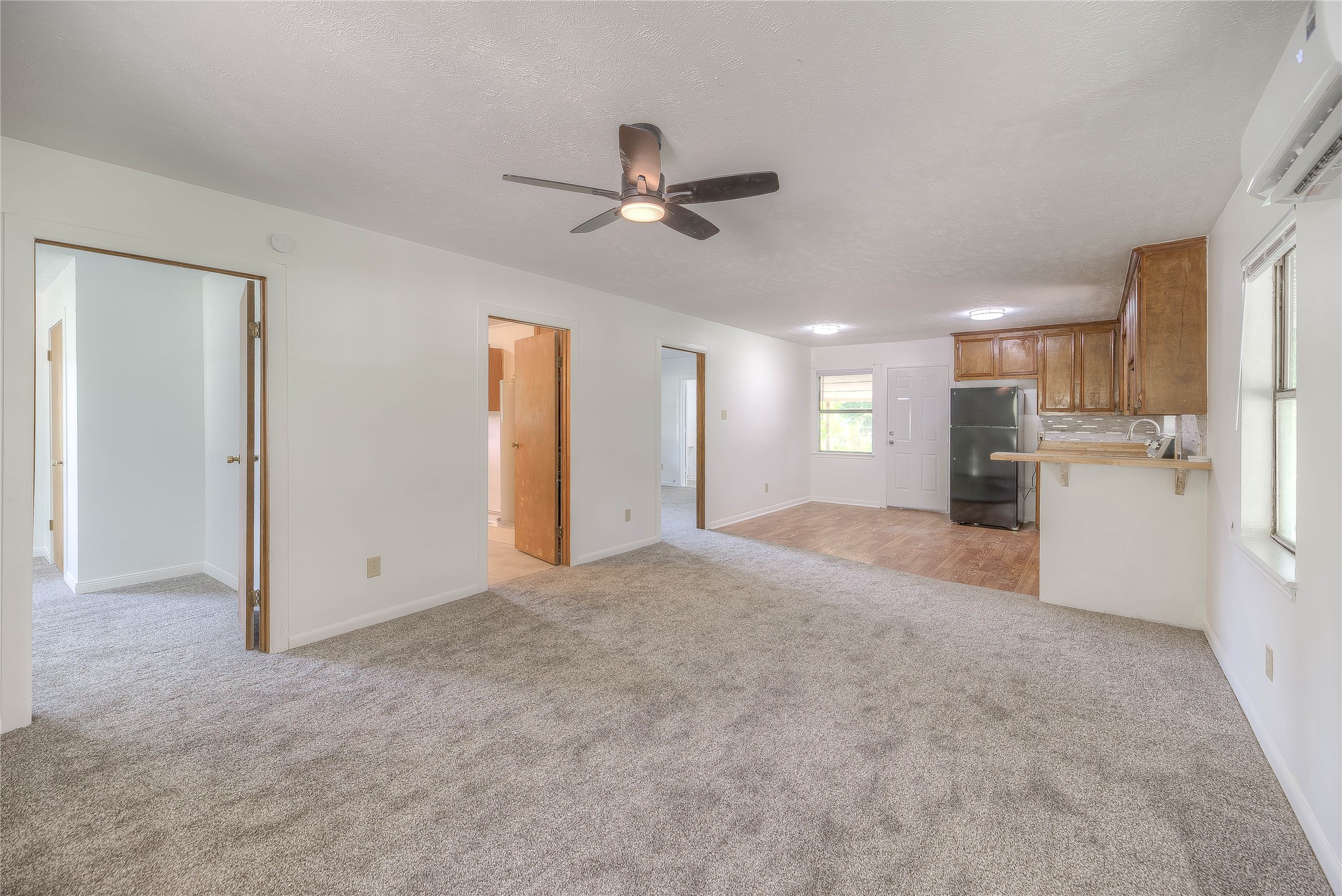 305 Oak Ridge Drive Onalaska, TX 77360 - Photo 11 of 29 a view of a kitchen with a sink and a refrigerator
