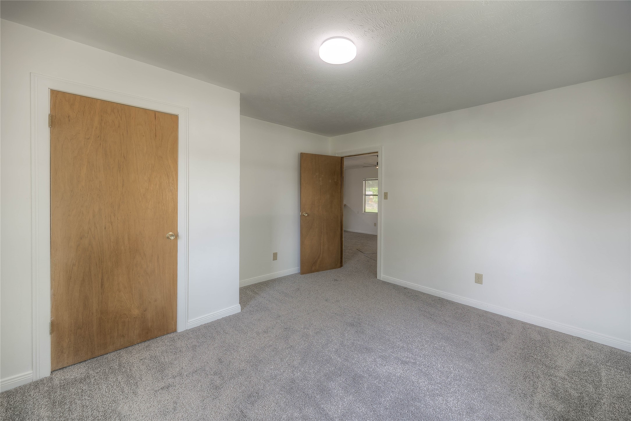 305 Oak Ridge Drive Onalaska, TX 77360 - Photo 4 of 29 a view of an empty room and a window