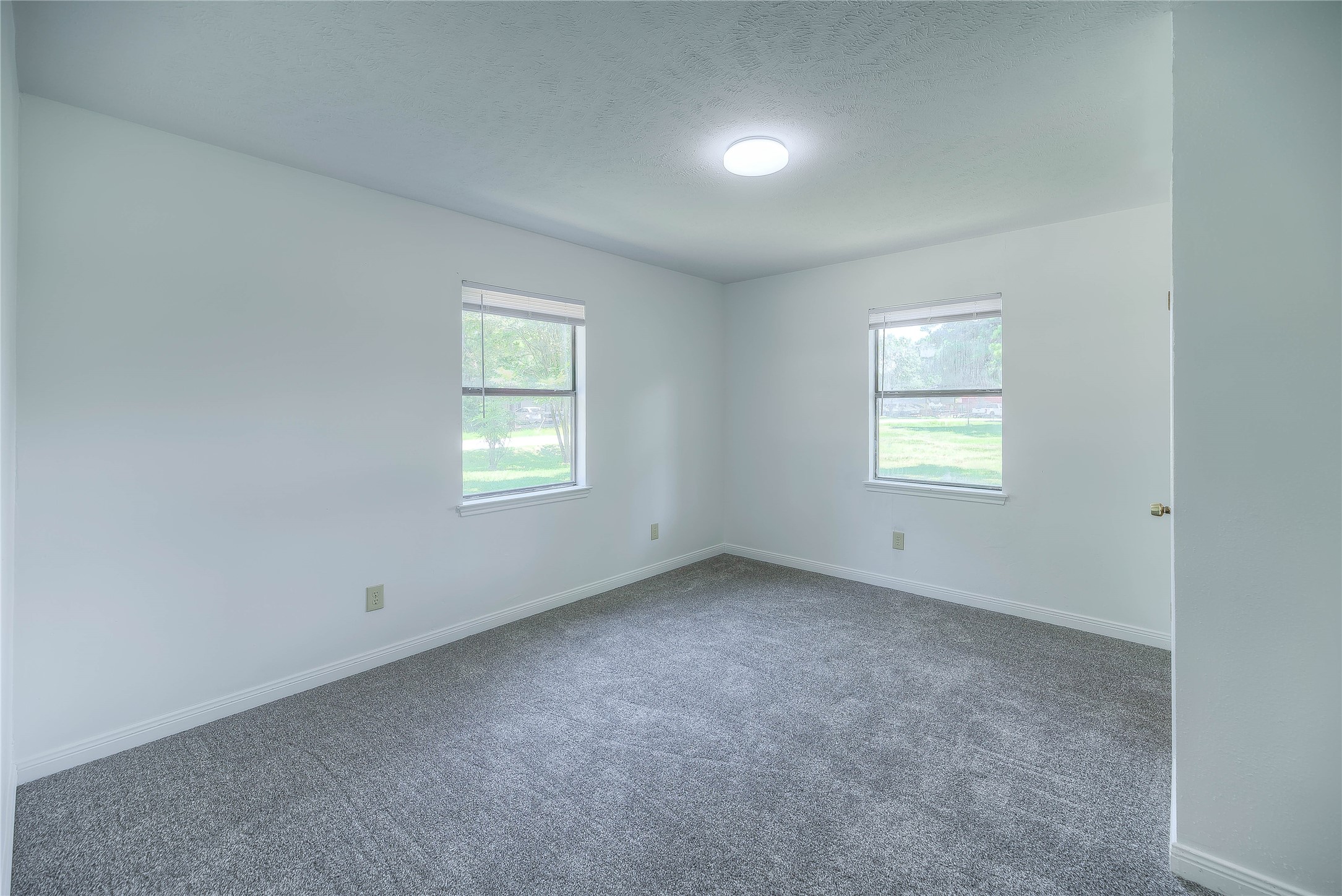 305 Oak Ridge Drive Onalaska, TX 77360 - Photo 5 of 29 an empty room with a window