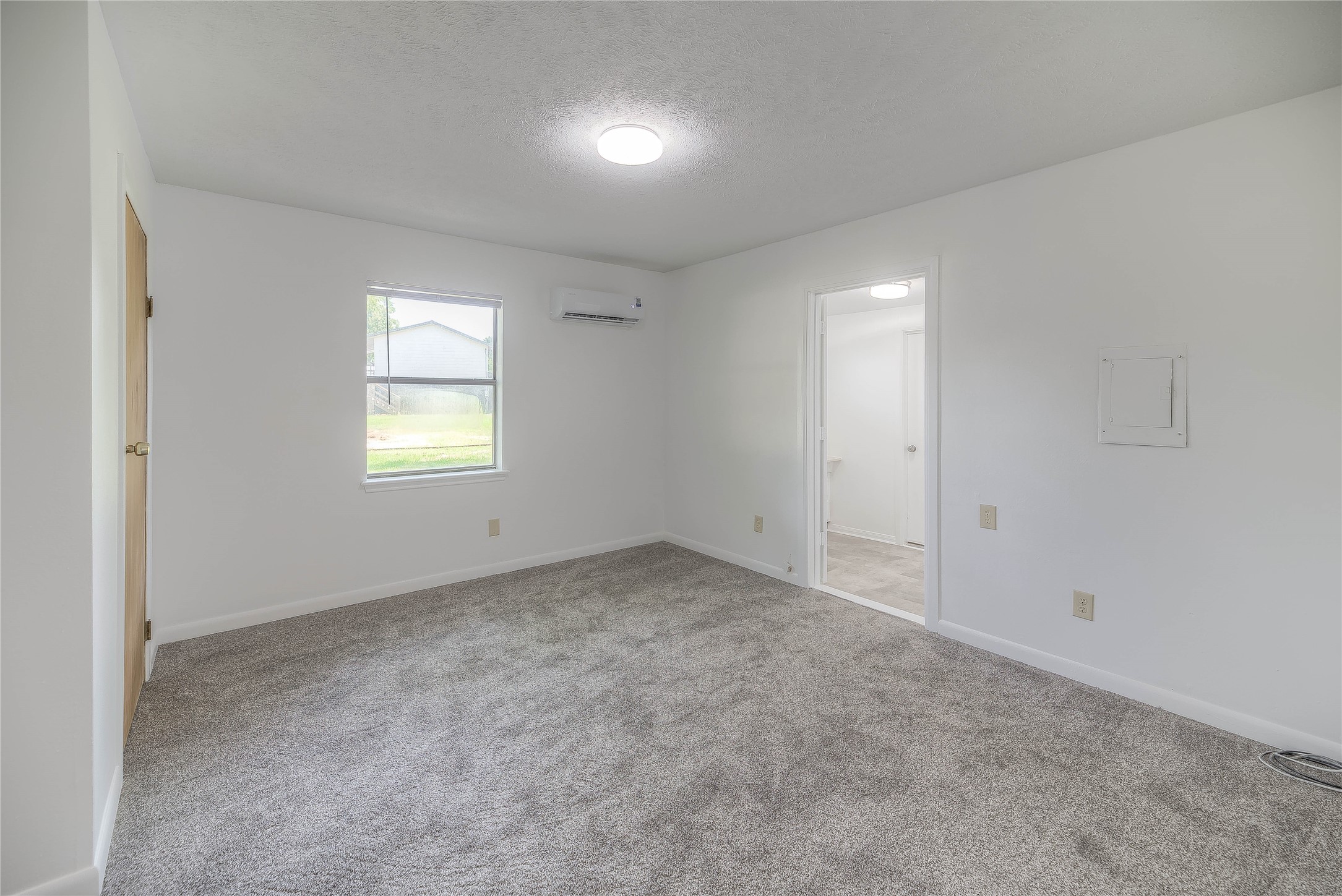 305 Oak Ridge Drive Onalaska, TX 77360 - Photo 9 of 29 an empty room with windows