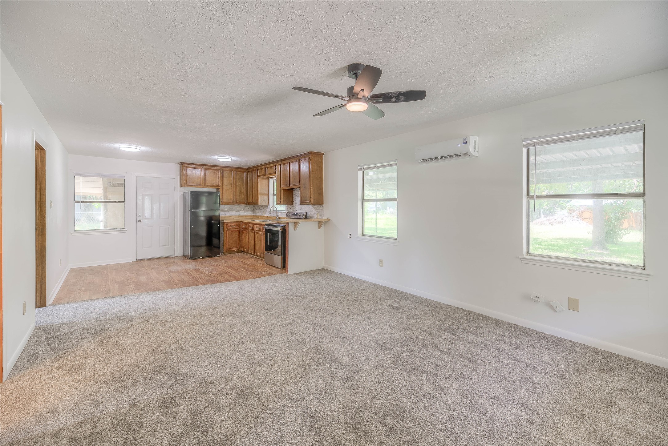 305 Oak Ridge Drive Onalaska, TX 77360 - Photo 10 of 29 a view of a livingroom with a window and a kitchen