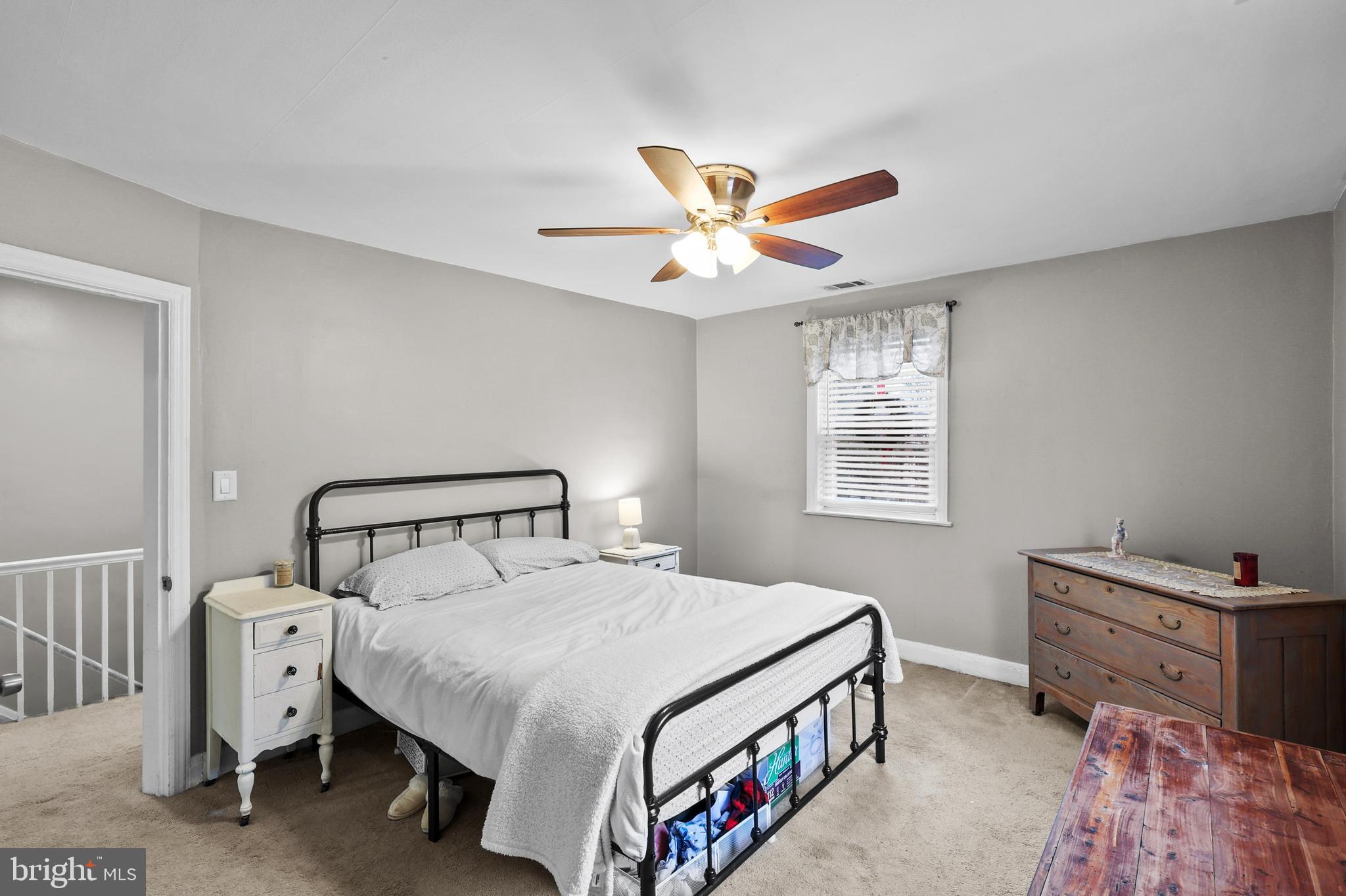 1020 Dartmouth Road Baltimore, MD 21212 - Photo 28 of 46 a bedroom with a bed and a chandelier