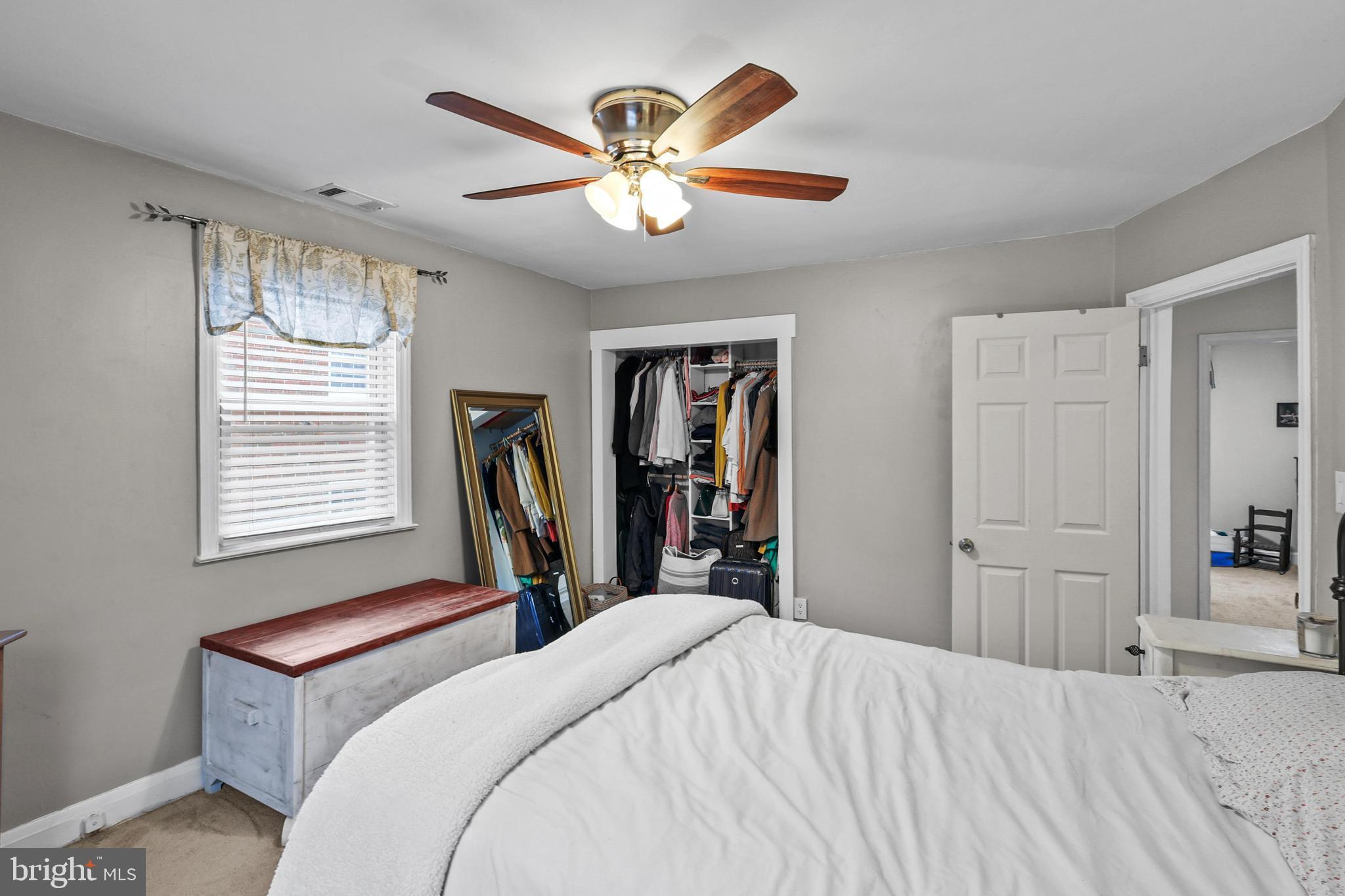 1020 Dartmouth Road Baltimore, MD 21212 - Photo 29 of 46 a bed room with a bed and a chandelier