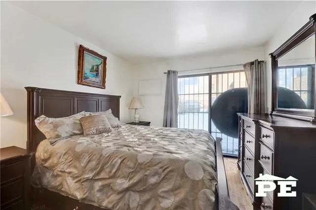 a bedroom with a bed and a television