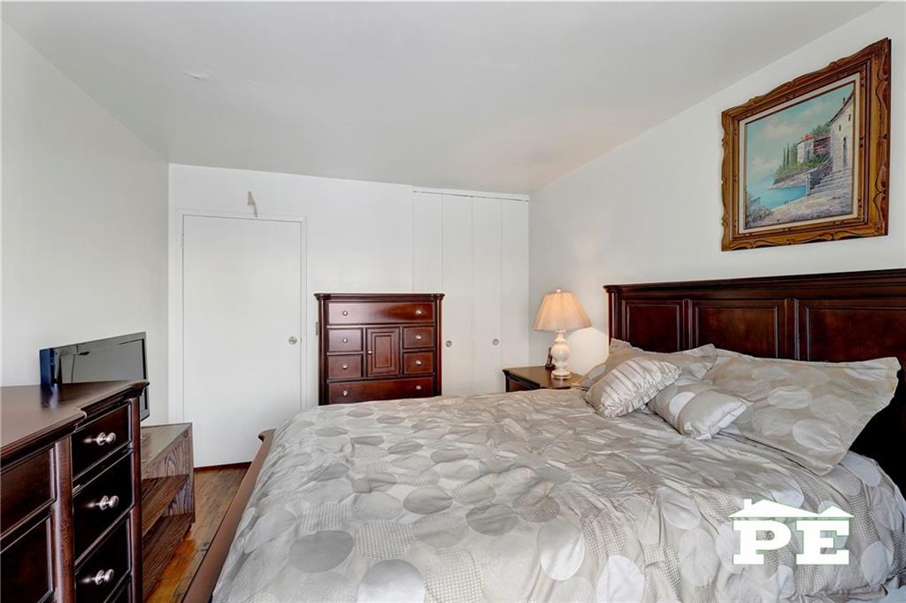 49 Erasmus Street, Unit 1A Brooklyn, NY 11226 - Photo 18 of 29 a bedroom with a bed and a television