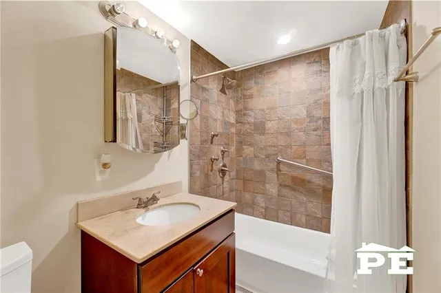 a bedroom with a bed and flat screen tv