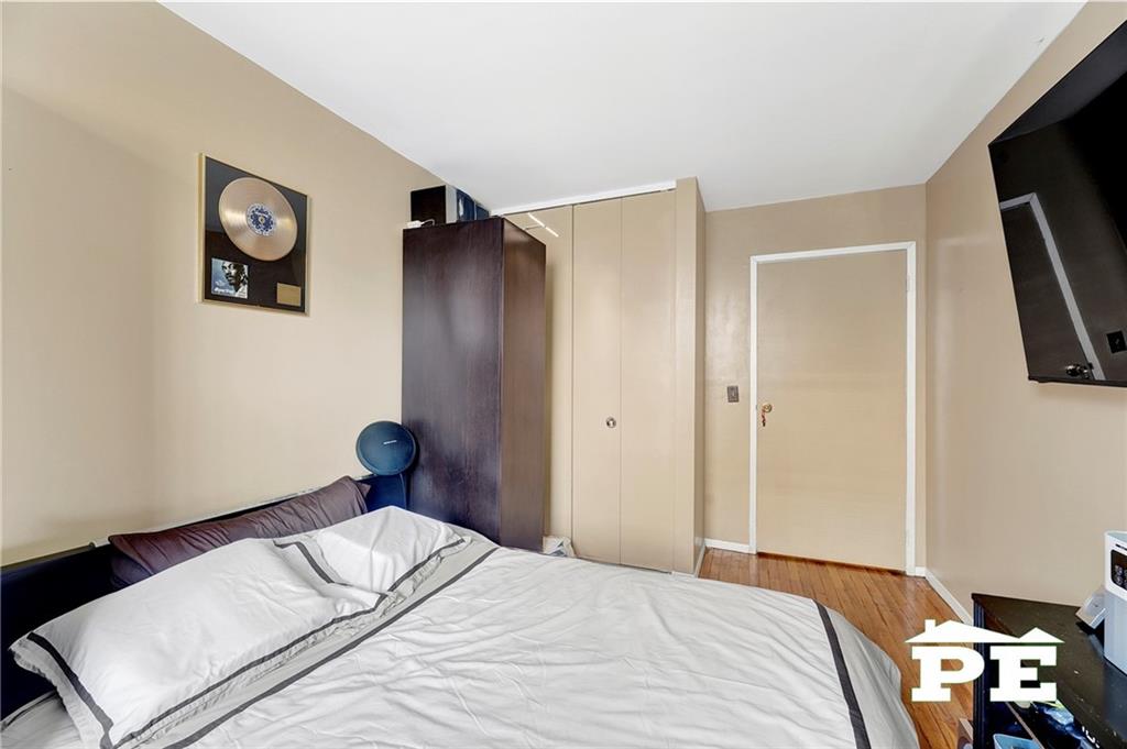 49 Erasmus Street, Unit 1A Brooklyn, NY 11226 - Photo 22 of 29 a bedroom with a bed and a tv