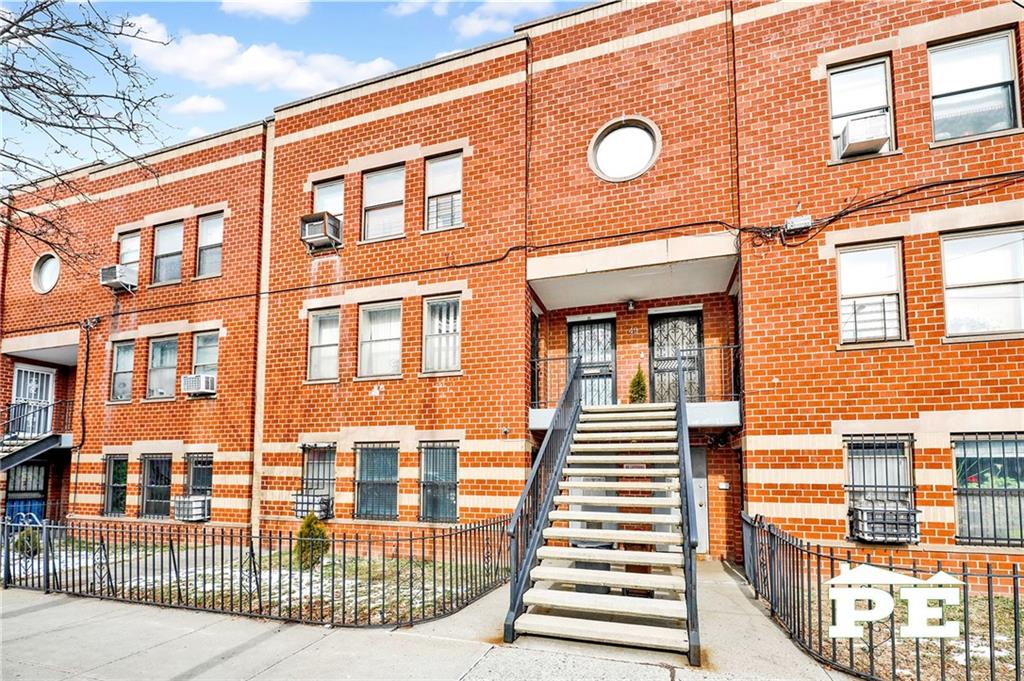 49 Erasmus Street, Unit 1A Brooklyn, NY 11226 - Photo 27 of 29 a view of a brick building with many windows