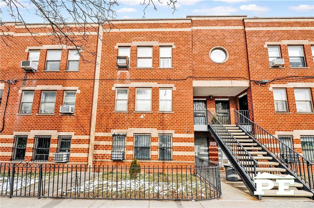 49 Erasmus Street, Unit 1A Brooklyn, NY 11226 - Photo 28 of 29 a front view of a building with many windows