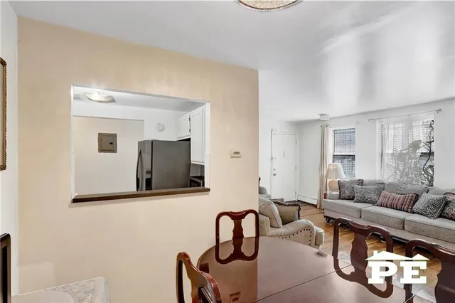 a kitchen with stainless steel appliances granite countertop a refrigerator and a stove