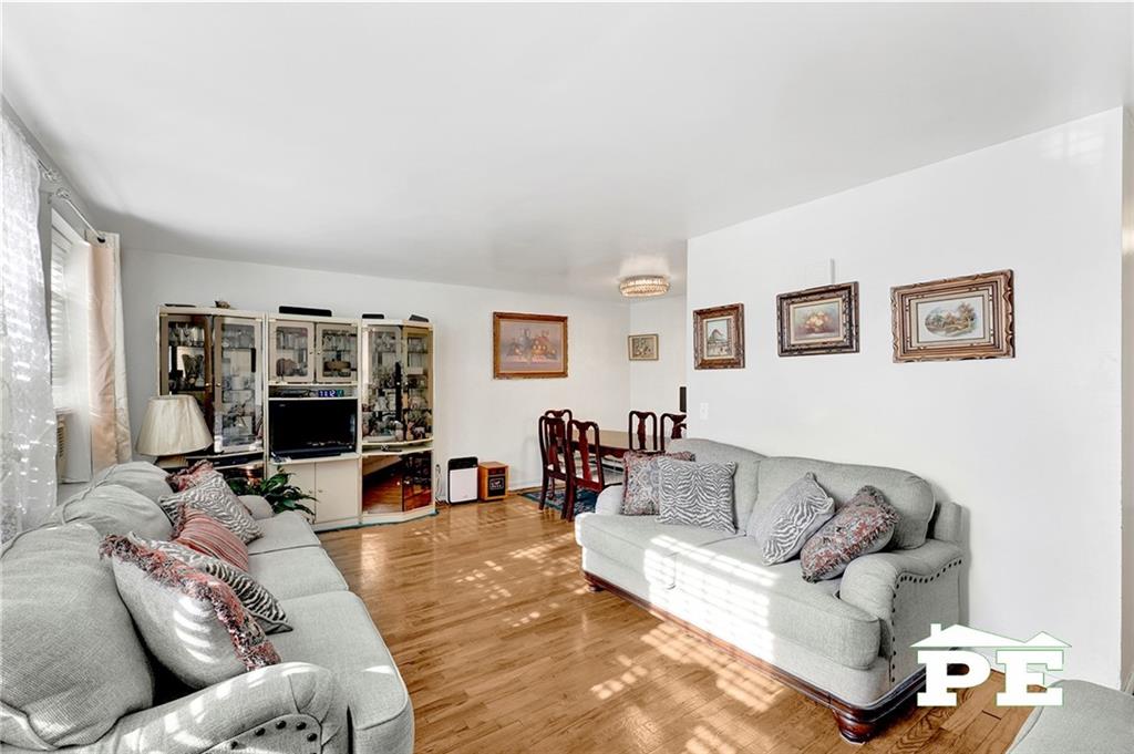 49 Erasmus Street, Unit 1A Brooklyn, NY 11226 - Photo 10 of 29 a living room with furniture and a flat screen tv