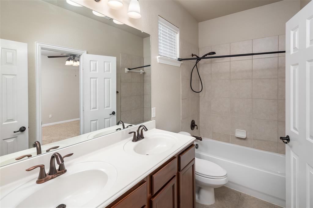 4245 Swan Forest Drive, Unit B Carrollton, TX 75010 - Photo 15 of 26 Bathroom with double vanity and tub / shower combination