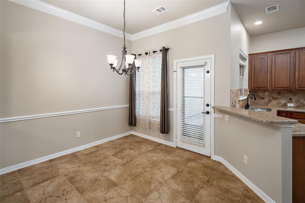 4245 Swan Forest Drive, Unit B Carrollton, TX 75010 - Photo 7 of 26 Unfurnished dining area with a chandelier and ornamental molding