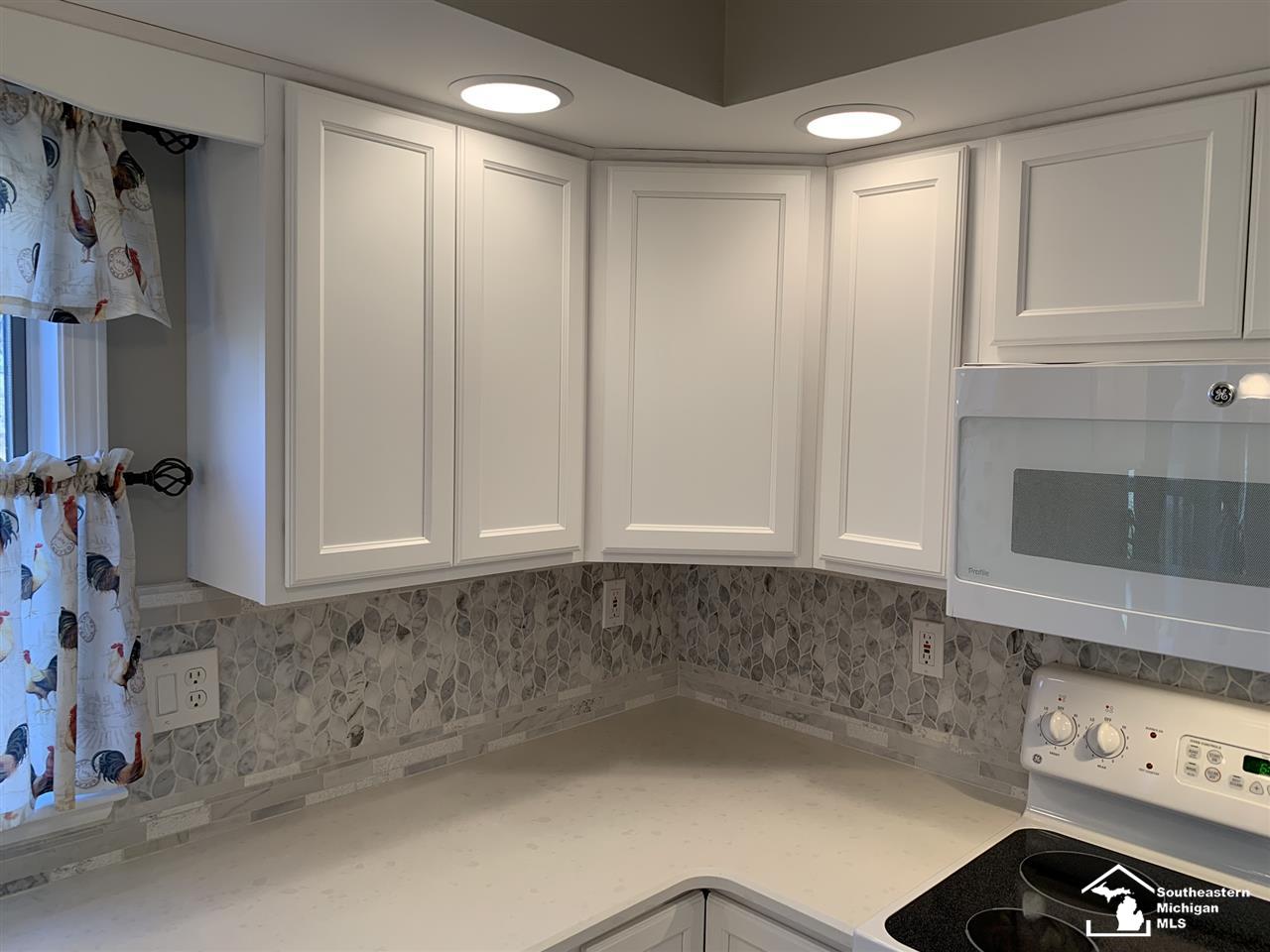 10412 Bacon Road Petersburg, MI 49270 - Photo 17 of 95 Beautiful new kitchen featuring Thomasville Cabinetry, quartz countertops, ceramic tile and new appliances.