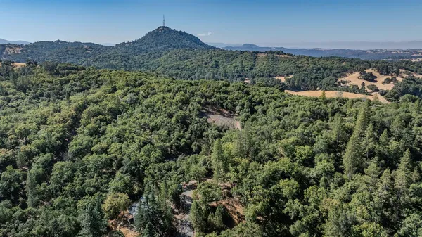 a view of a mountain with mountains in the background
