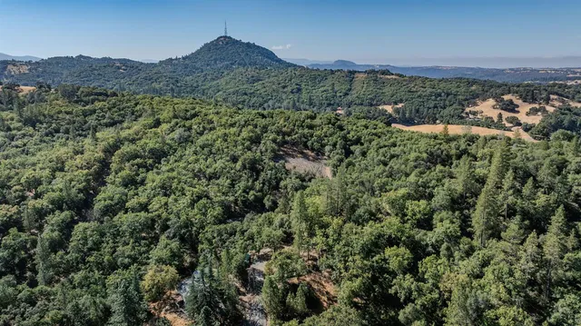 a view of a mountain with mountains in the background