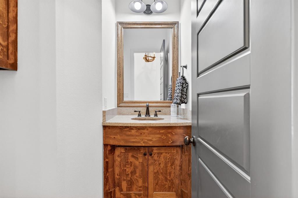 301 Rustic View Lane Aledo, TX 76008 - Photo 22 of 40 a bathroom with a granite countertop sink and a mirror