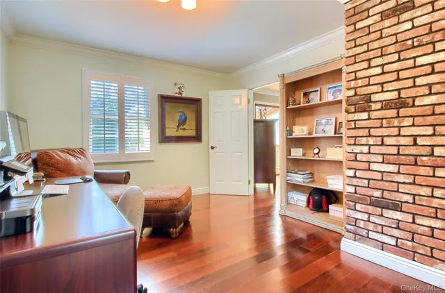 a living room with furniture window and wooden floor