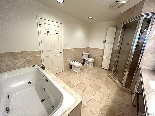 a bathroom with a bathtub sink and toilet