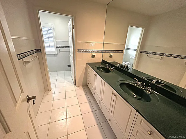 a kitchen with a stove a refrigerator and storage