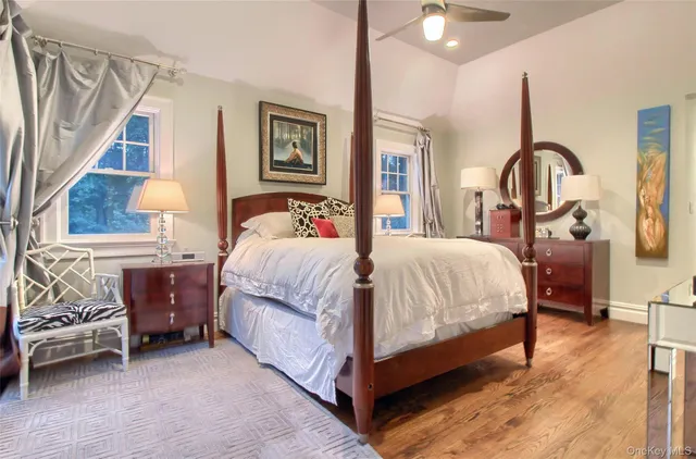 a bedroom with bed and a window