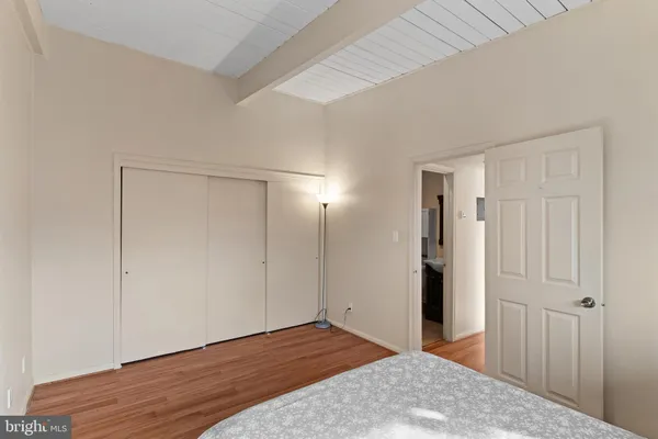 a view of hallway with wooden floor