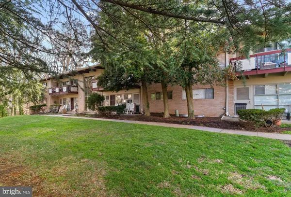 a couple of table and chairs in the yard