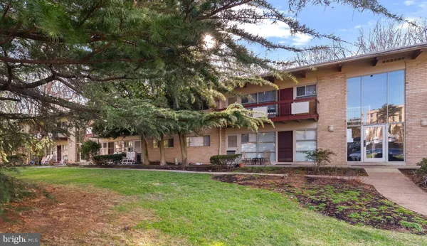 a view of a building with a yard