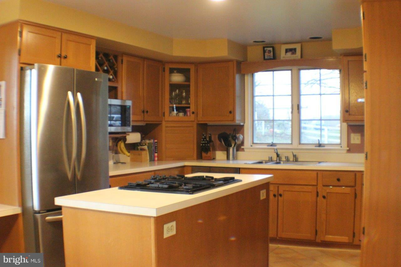 2701 Greene Road Baldwin, MD 21013 - Photo 5 of 29 a kitchen with a sink a refrigerator and a stove