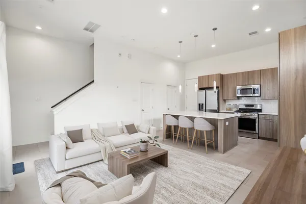 a kitchen with a sink stove and cabinets