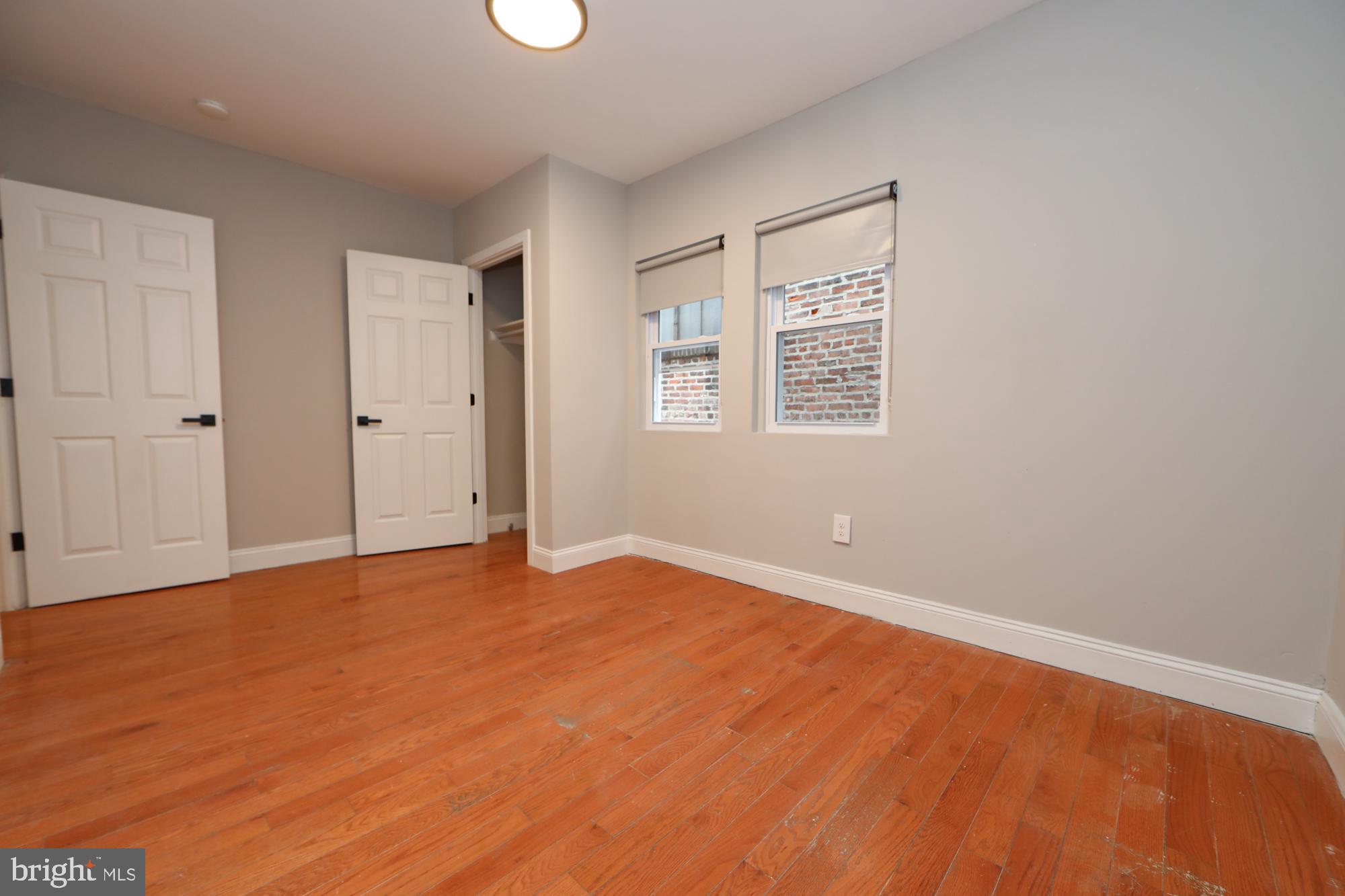 931 Spring Garden Street, Unit 2 Philadelphia, PA 19123 - Photo 12 of 24 a view of an empty room with a window