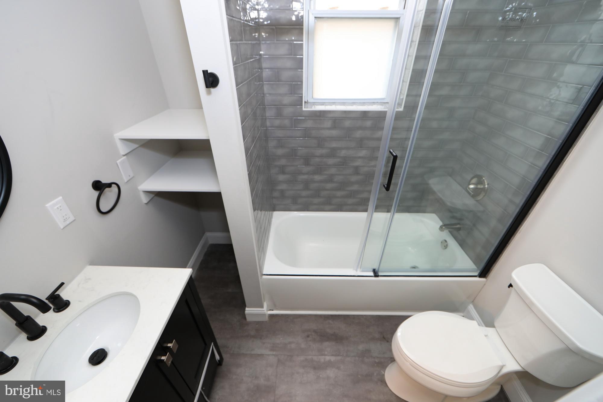 931 Spring Garden Street, Unit 2 Philadelphia, PA 19123 - Photo 14 of 24 a bathroom with a sink and a vanity