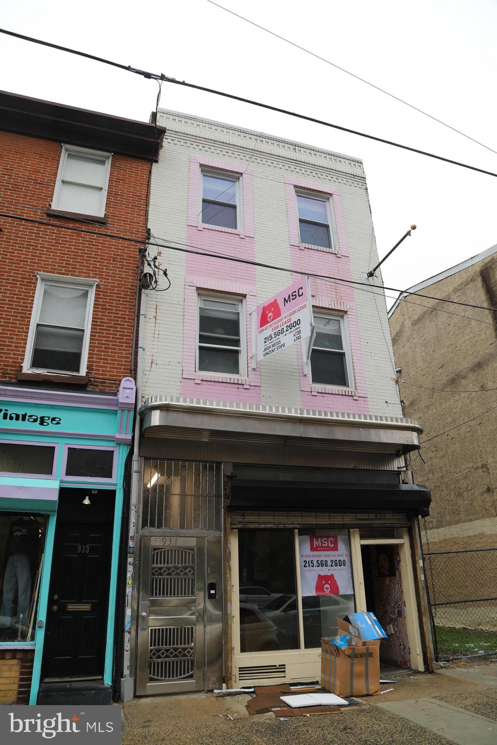 931 Spring Garden Street, Unit 2 Philadelphia, PA 19123 - Photo 20 of 24 a front view of a building with many windows