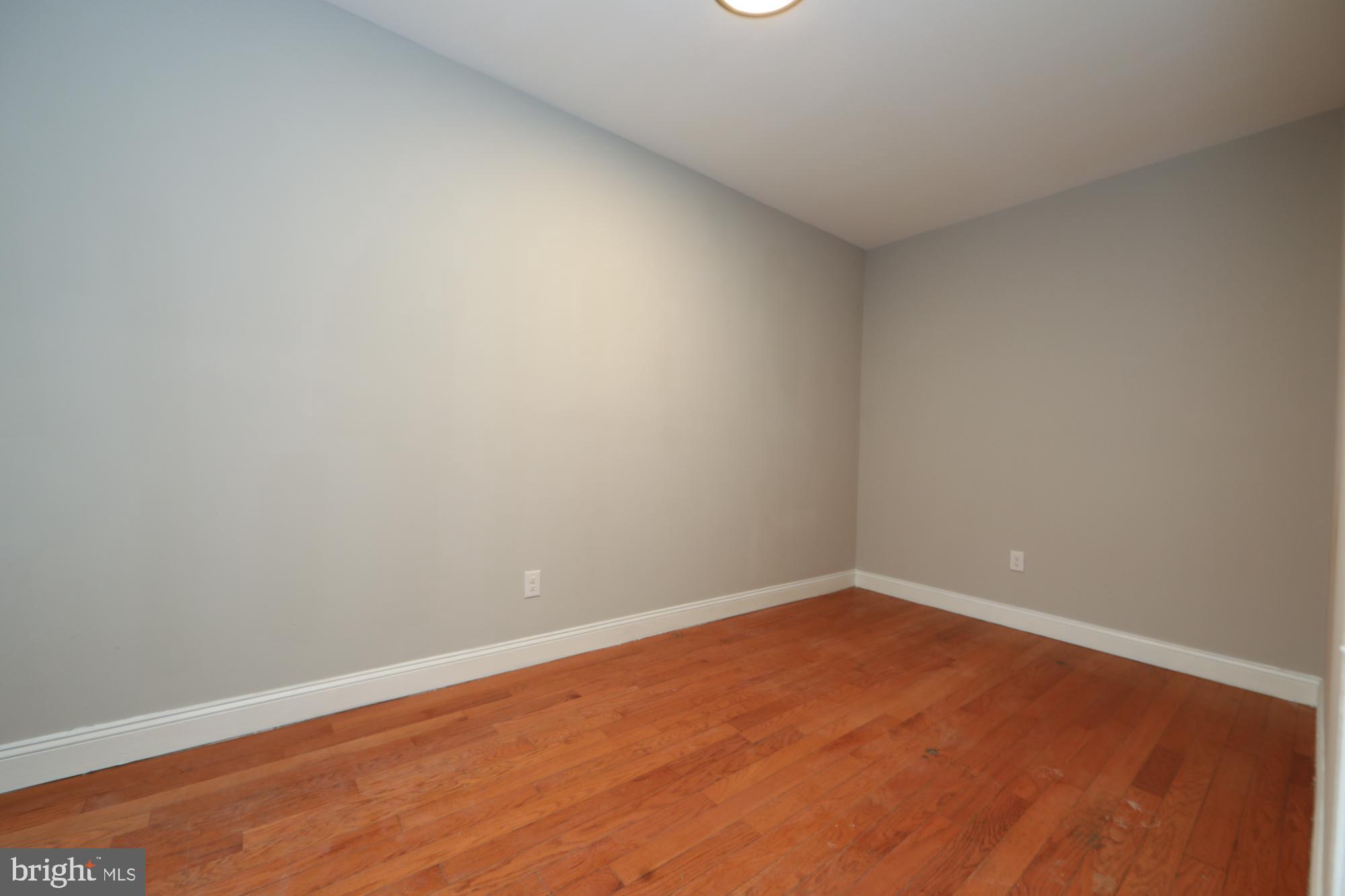 931 Spring Garden Street, Unit 2 Philadelphia, PA 19123 - Photo 2 of 24 a view of an empty room with wooden floor