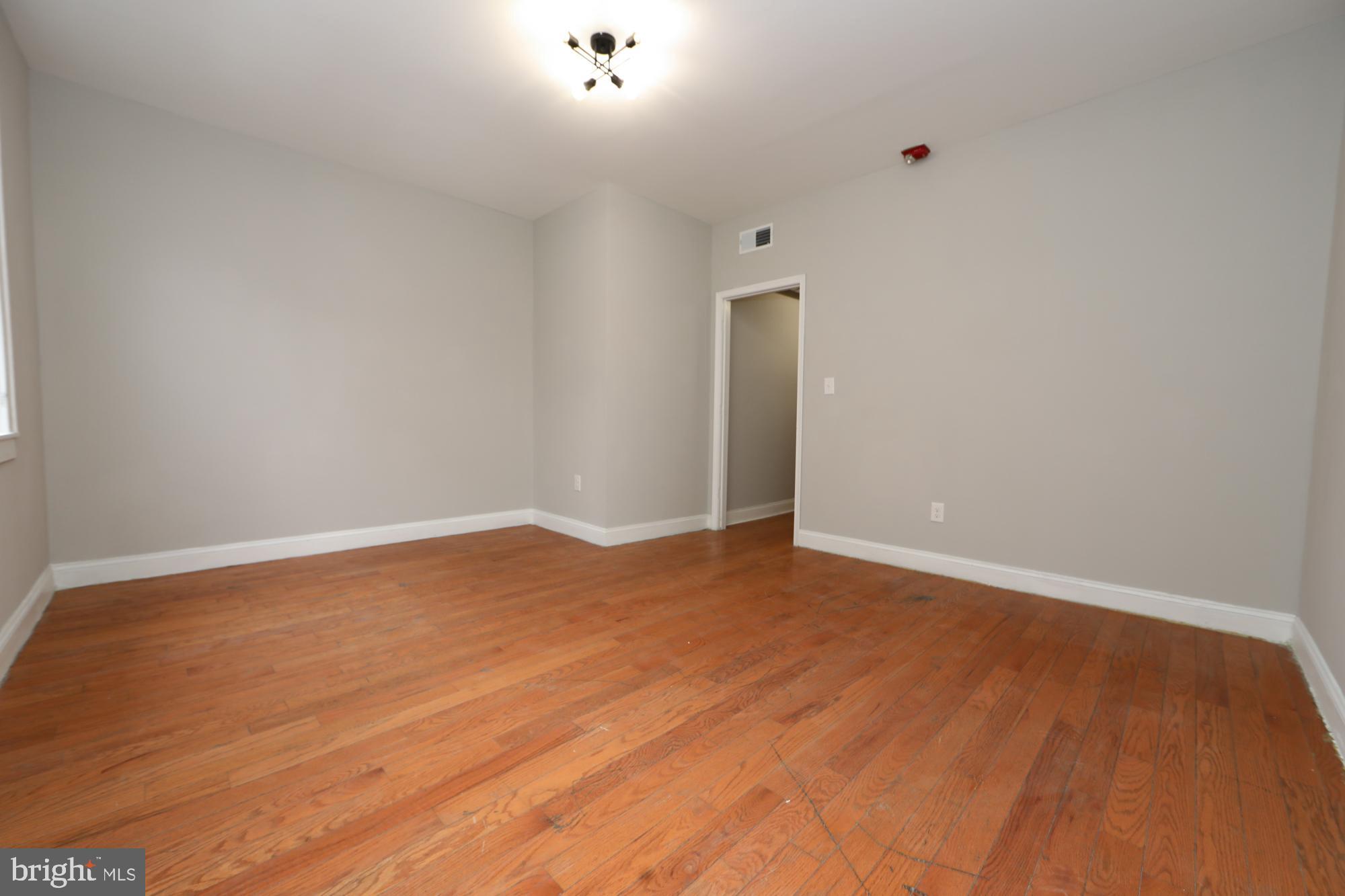931 Spring Garden Street, Unit 2 Philadelphia, PA 19123 - Photo 7 of 24 a view of empty room with wooden floor