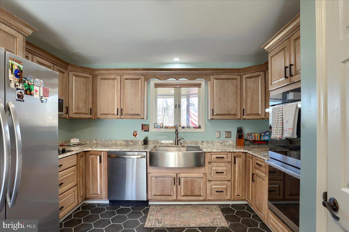 75 Thunder Trail Fairfield, PA 17320 - Photo 15 of 64 a kitchen with stainless steel appliances a refrigerator sink and cabinets