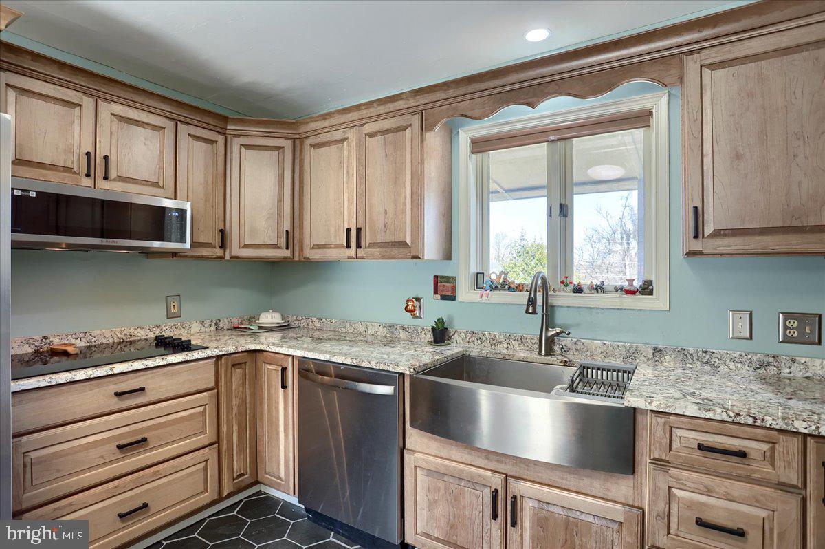75 Thunder Trail Fairfield, PA 17320 - Photo 16 of 64 a kitchen with granite countertop a sink and a stove top oven