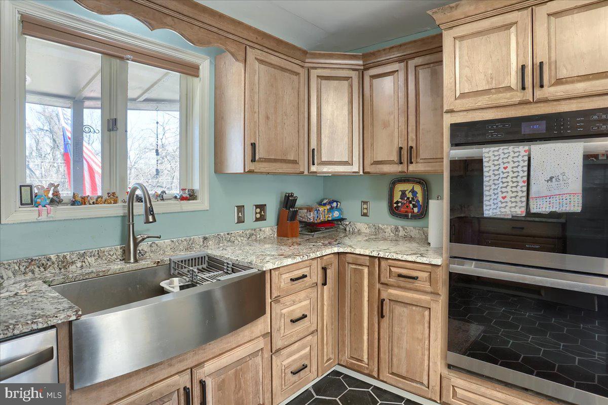 75 Thunder Trail Fairfield, PA 17320 - Photo 17 of 64 a kitchen with granite countertop a sink stainless steel appliances and cabinets