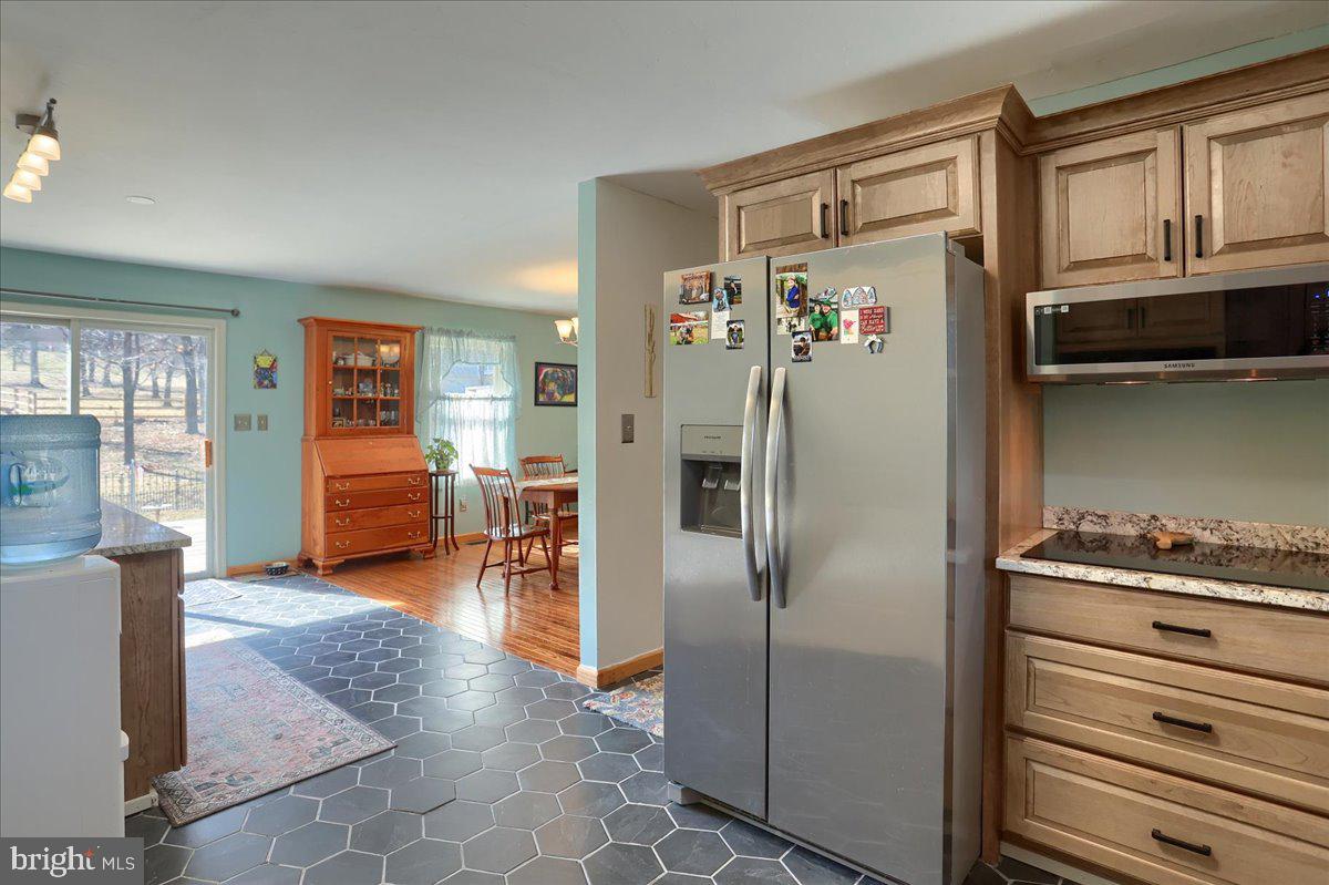 75 Thunder Trail Fairfield, PA 17320 - Photo 18 of 64 a kitchen with stainless steel appliances granite countertop a refrigerator and a stove