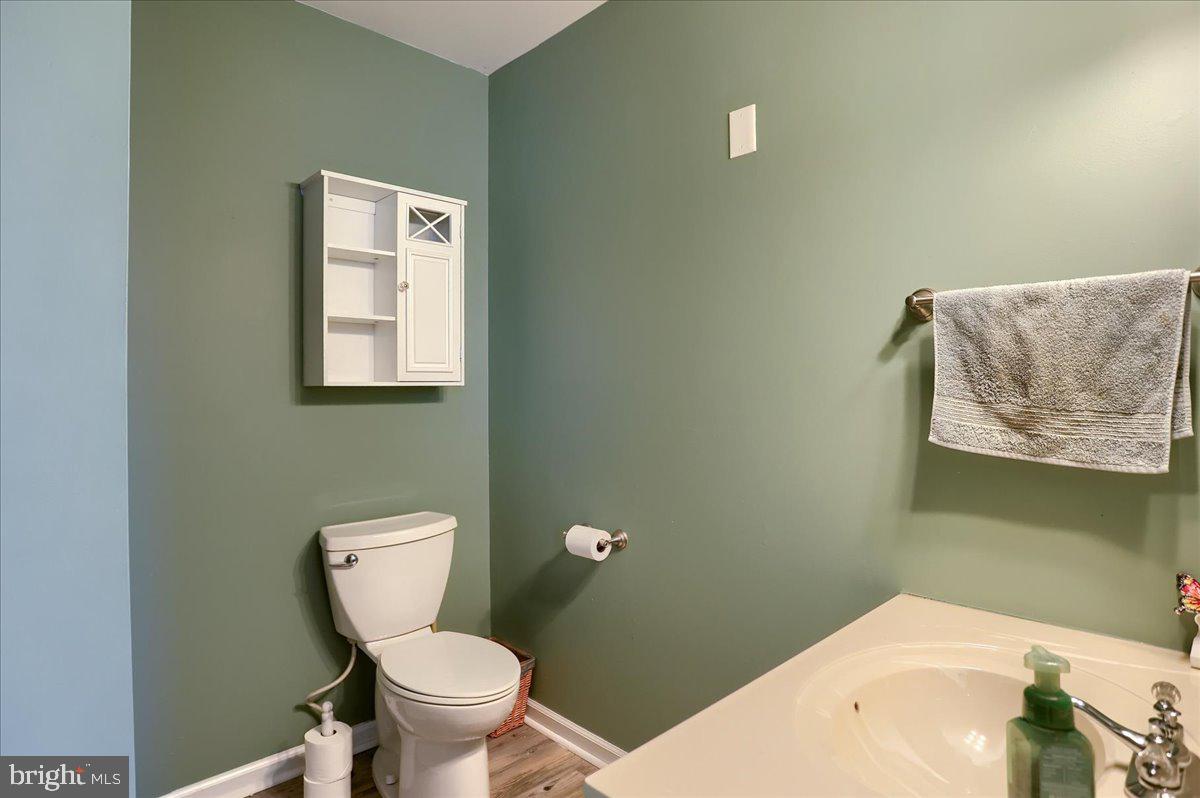 75 Thunder Trail Fairfield, PA 17320 - Photo 24 of 64 a white toilet sitting next to a bathroom sink