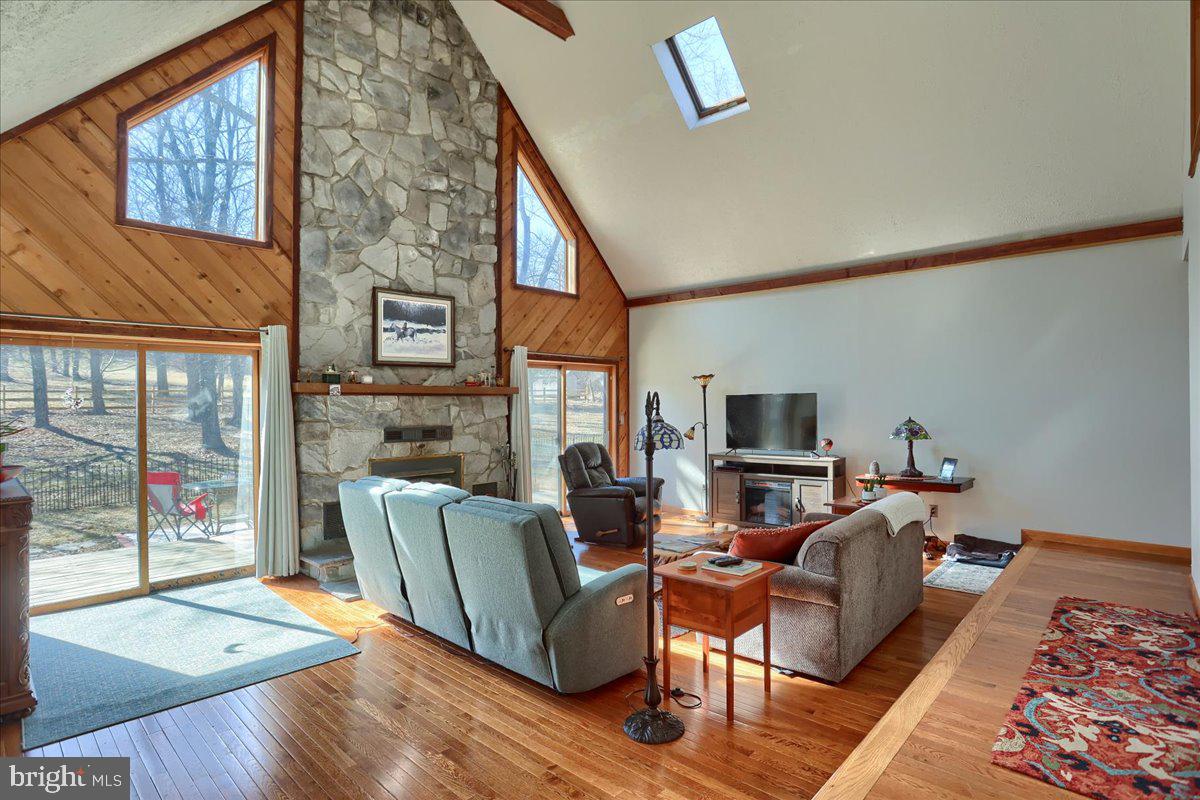 75 Thunder Trail Fairfield, PA 17320 - Photo 26 of 64 a living room with furniture a flat screen tv and a fireplace