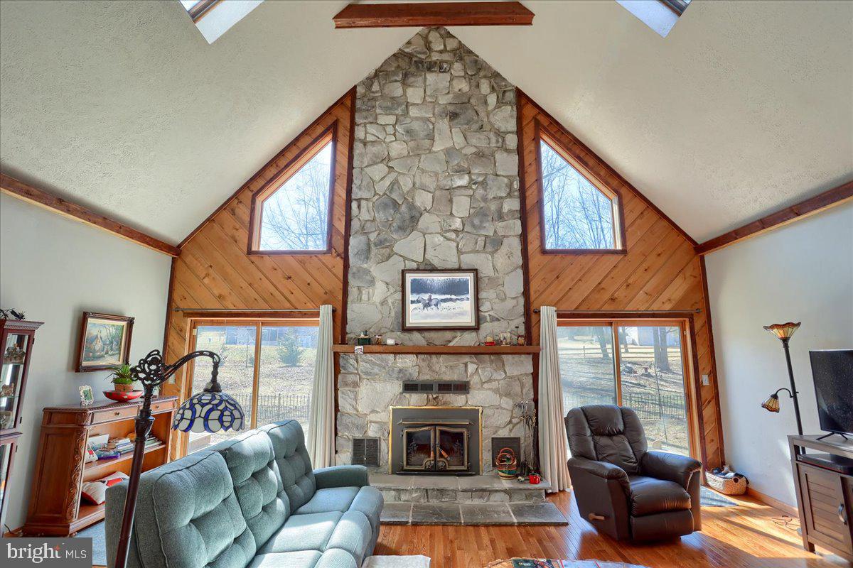 75 Thunder Trail Fairfield, PA 17320 - Photo 29 of 64 a living room with furniture a fireplace and a flat screen tv