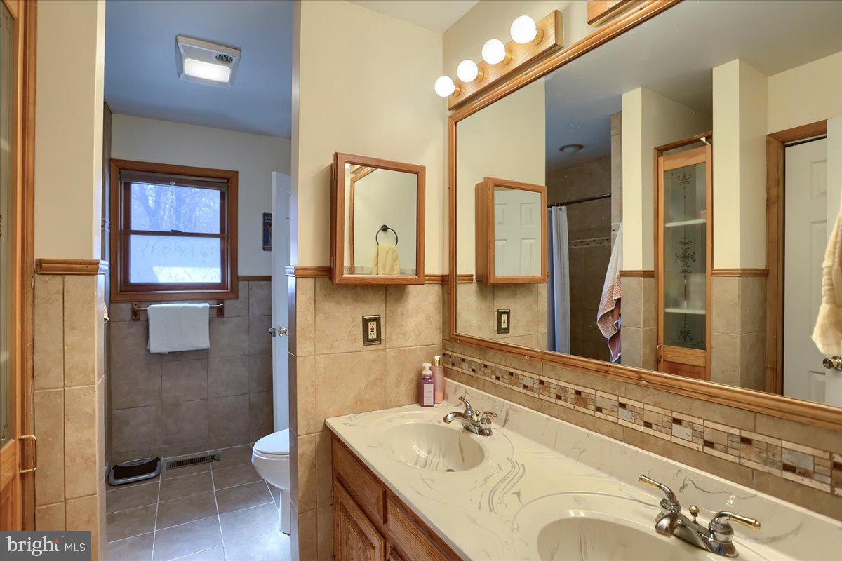 75 Thunder Trail Fairfield, PA 17320 - Photo 37 of 64 a bathroom with a sink double vanity and a toilet