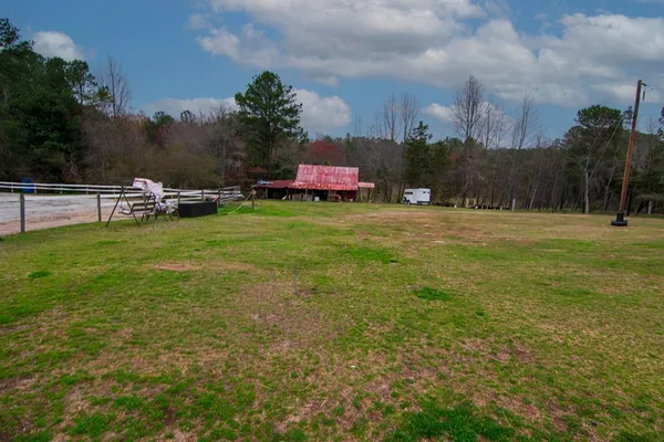 an aerial view of a house with yard swimming pool and outdoor seating