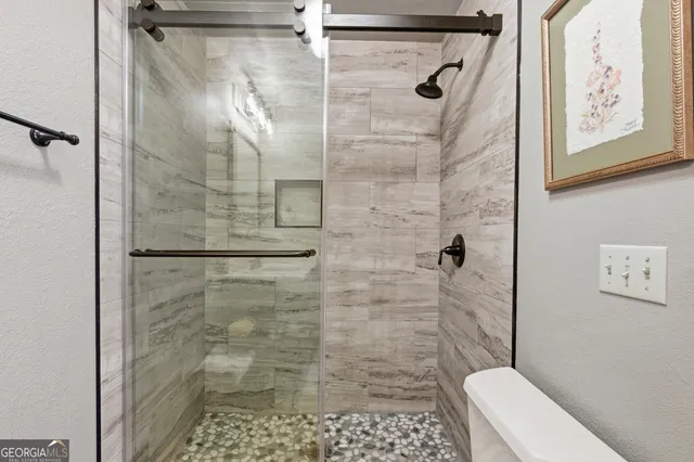 a view of a patio with chair and tables