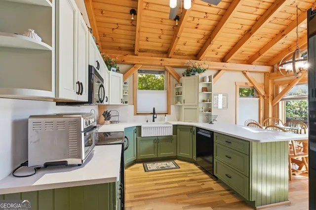 a dining room with furniture and a chandelier