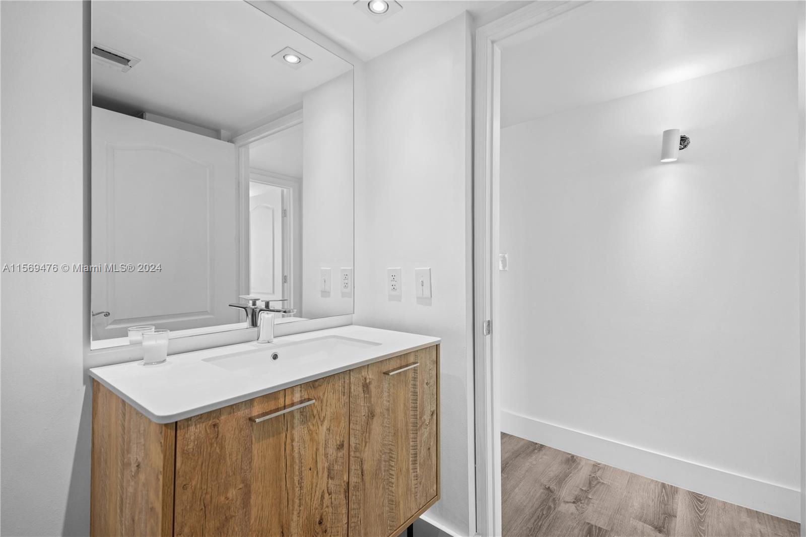 2101 Brickell Avenue, Unit 2012 Miami, FL 33129 - Photo 13 of 44 a bathroom with a sink and a mirror