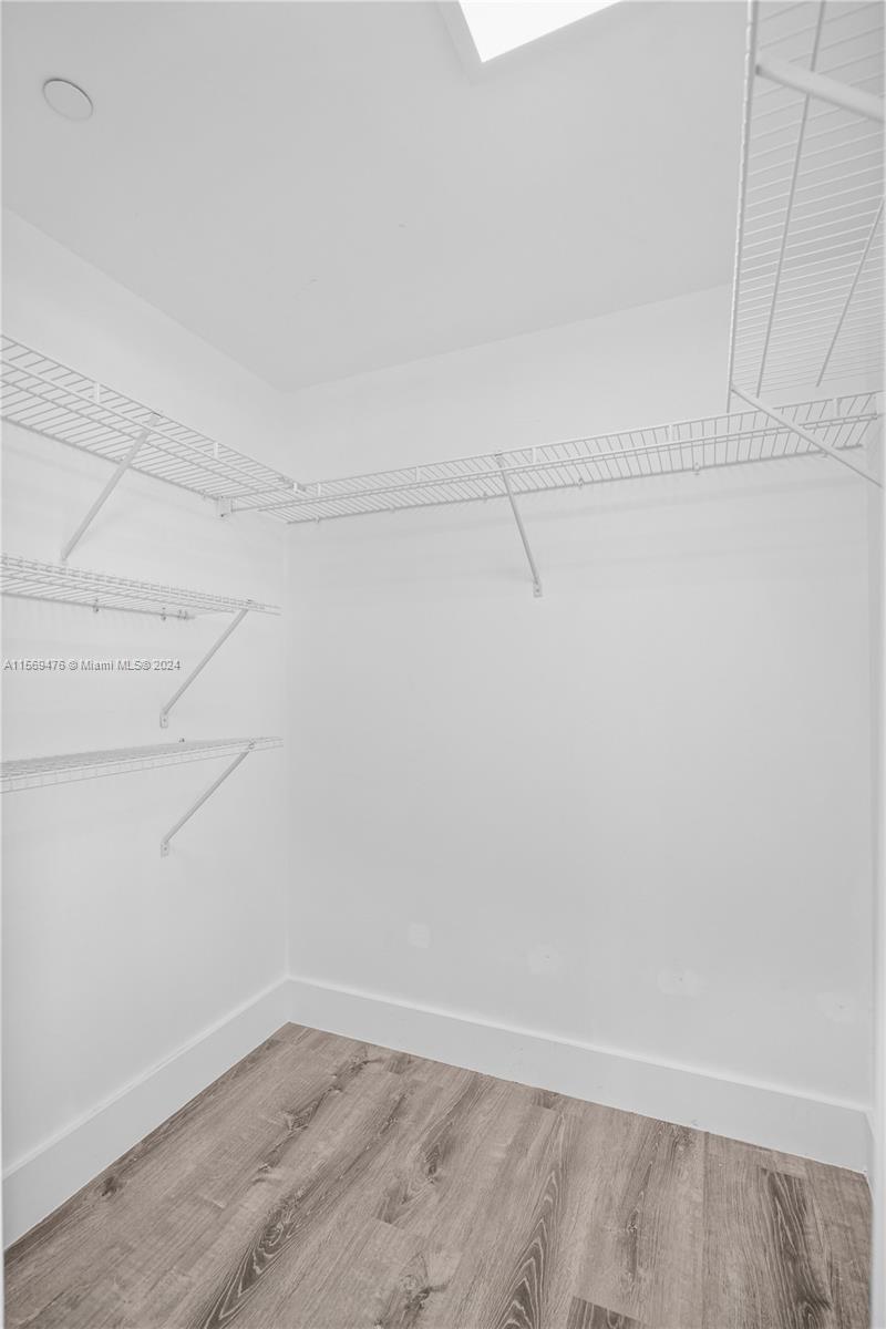 2101 Brickell Avenue, Unit 2012 Miami, FL 33129 - Photo 17 of 44 a view of a room with racks on the wall