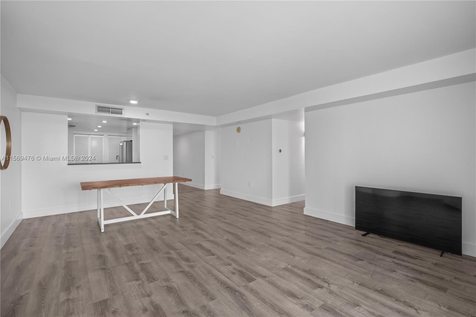 2101 Brickell Avenue, Unit 2012 Miami, FL 33129 - Photo 27 of 44 a view of a livingroom with wooden floor and furniture